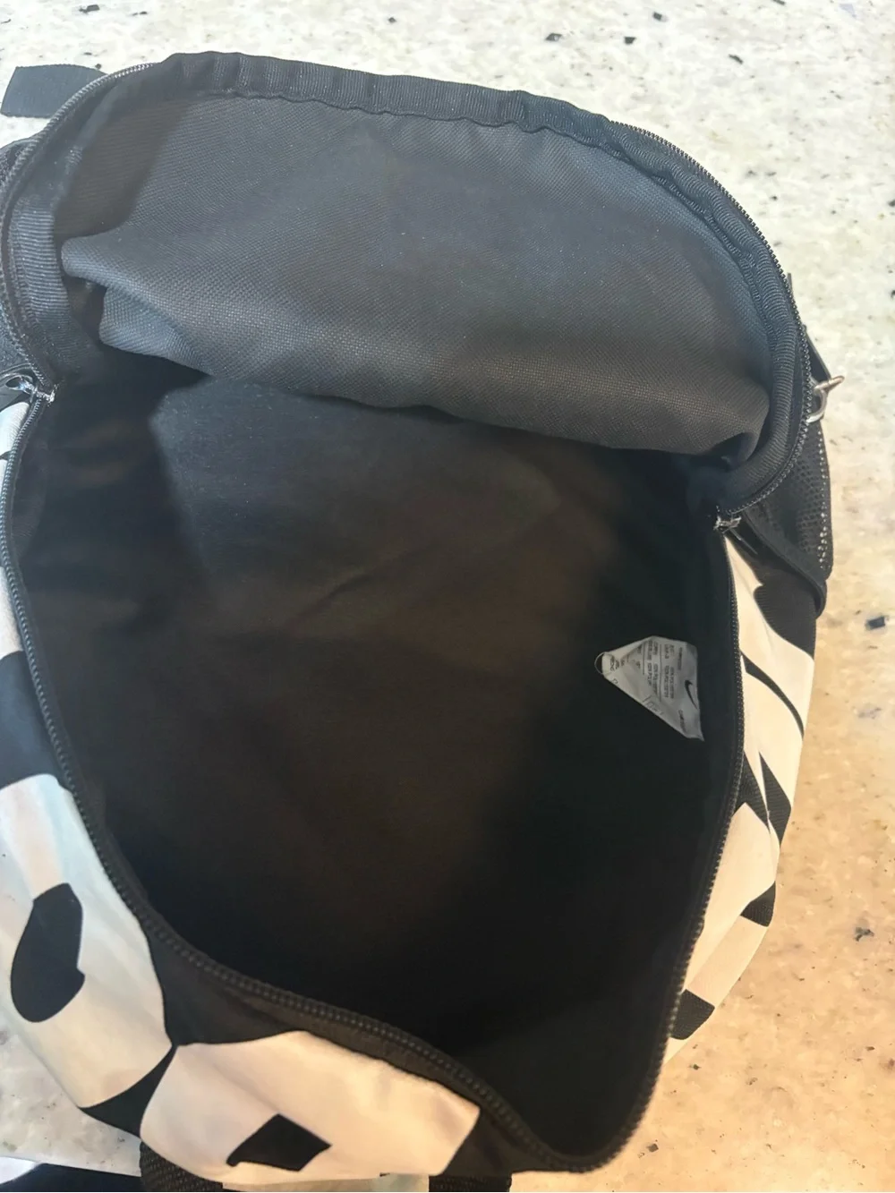 Nike Black and White Mini Backpack with Swoosh Accent